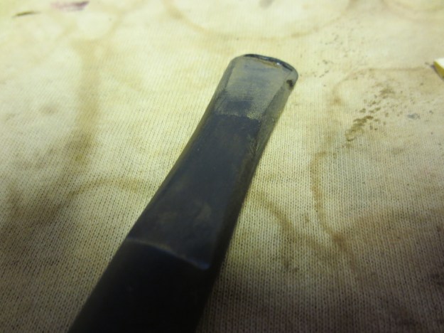 Figure 1 Top view of the stem before I worked on it. There were bite marks, tooth marks and pieces missing.