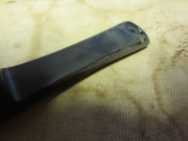 Figure 2 I sanded down the stem and filled the deep pits with black superglue. The top side of the stem shows the shiny black glue patches.