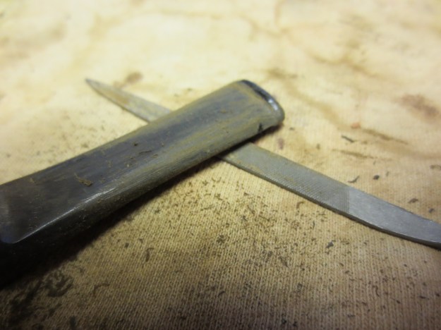 Figure 4 The stem is beginning to take shape after much filing and sanding on the sides and around the button. This is a photo of the topside of the stem.